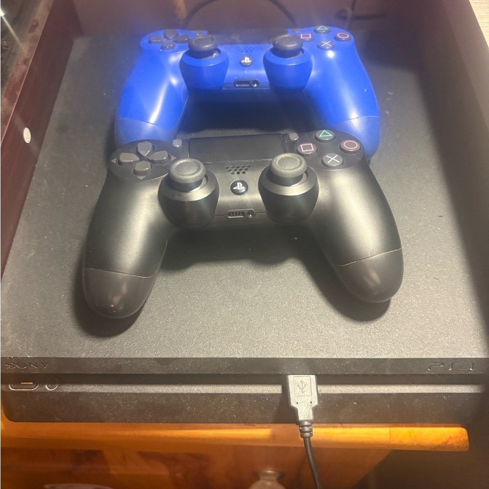 Sony PS4 Console with Black and Blue Controllers